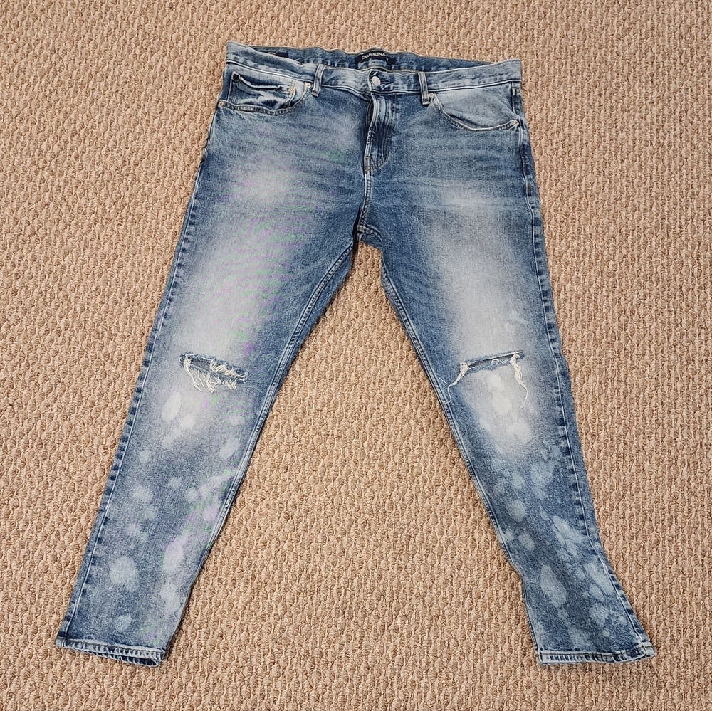 CALVIN KLEIN BLEACH STAINED RIPPED JEANS